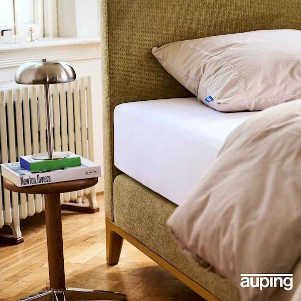 Auping Criade box spring with moss-green upholstery and new lacquer colour 'Mustard'.