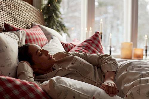 Woman relaxing in a Lexington Christmas bed