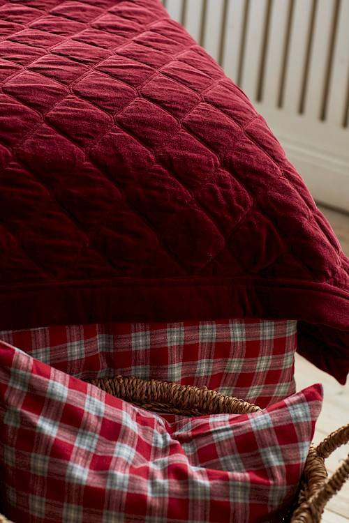 Quilted bedspread in deep red color